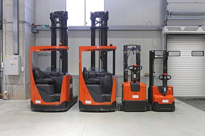 forklifts moving materials in a storage facility